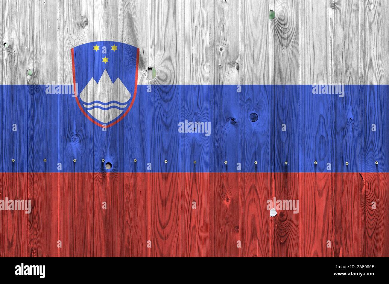 Slovenia flag depicted in bright paint colors on old wooden wall close ...