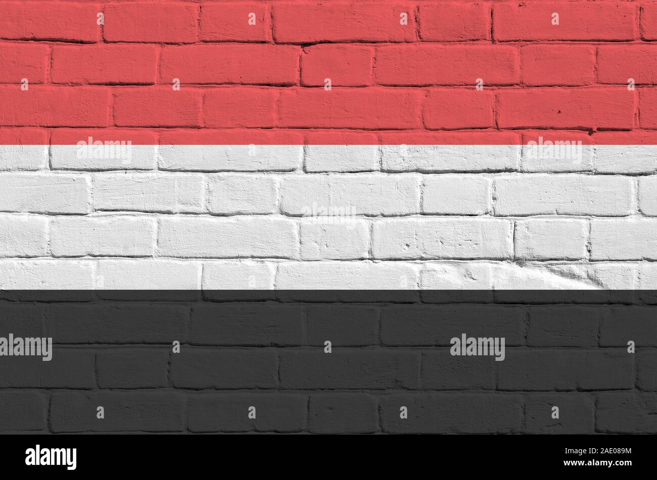 Yemen flag depicted in paint colors on old brick wall close up ...