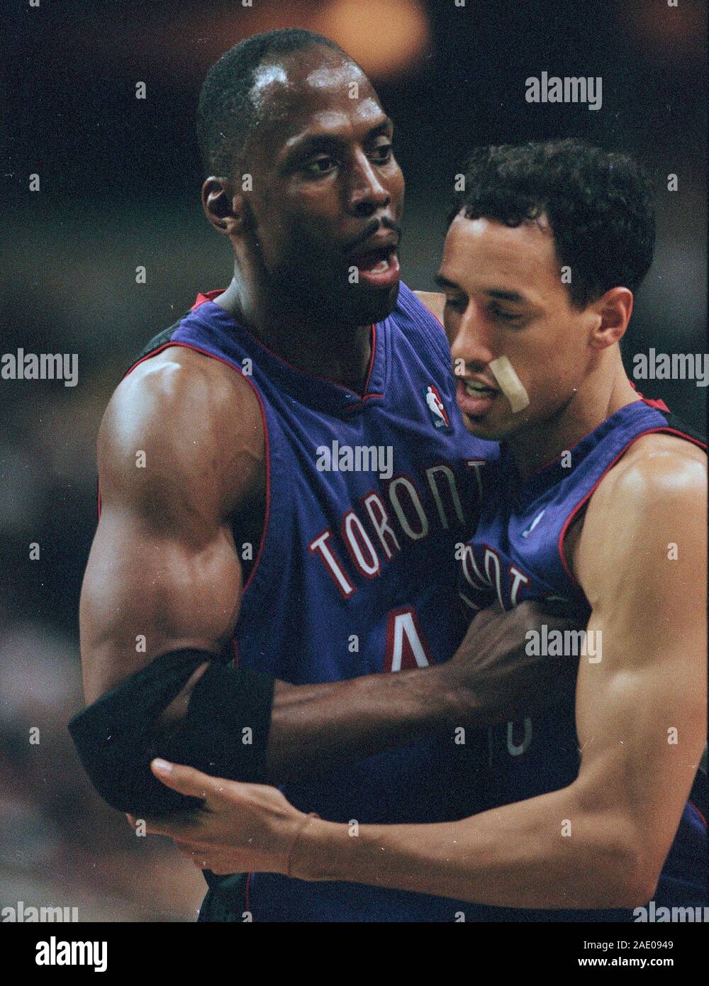 Toronto Raptors Michael Stewart and Doug Christie during basketball game action against the Boston Celtics at the Fleet Center in Boston Ma USA Mar 1,2000 photo by bill belknap Stock Photo