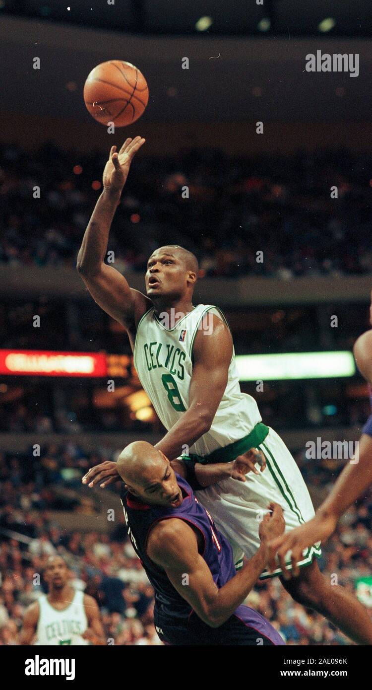 Boston Celtics #8 Antoine Walker shoots  on top of Toronto Raptors #15 Vice Carter in basketball game action at the Fleet Center in Boston Ma USA Mar 1,2000 photo by bill belknap Stock Photo