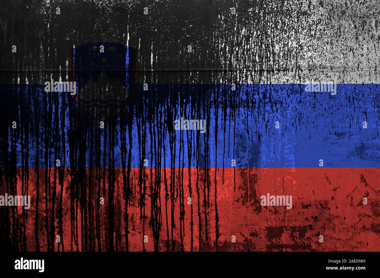 Slovenia flag depicted in paint colors on old and dirty oil barrel wall ...