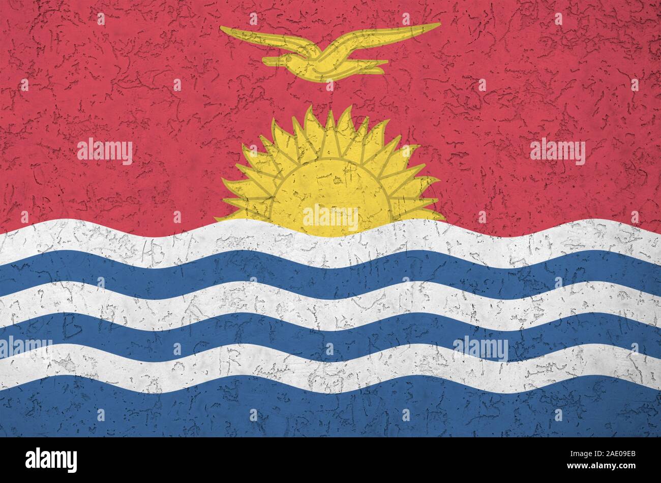 Kiribati flag depicted in bright paint colors on old relief plastering wall close up. Textured banner on rough background Stock Photo