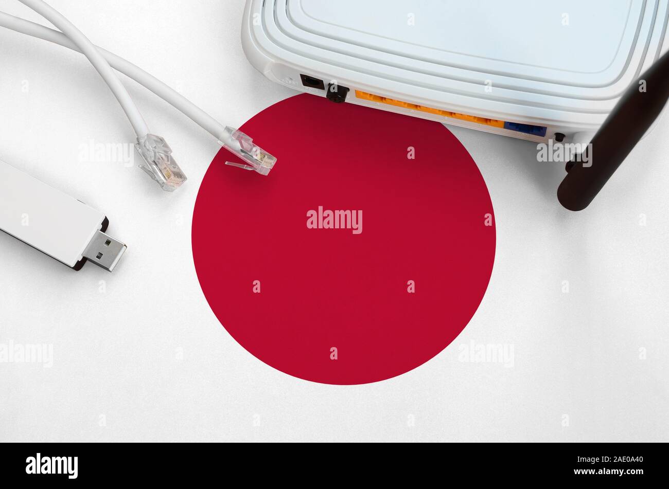 Japan flag depicted on table with rj45 cable, wireless usb wi