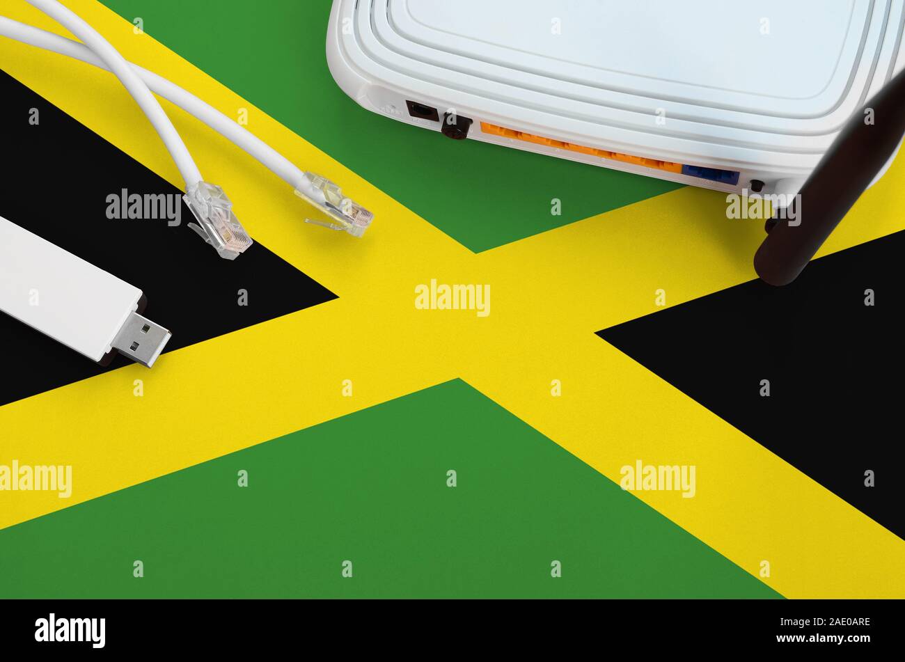 Jamaica flag depicted on table with rj45 cable, wireless usb