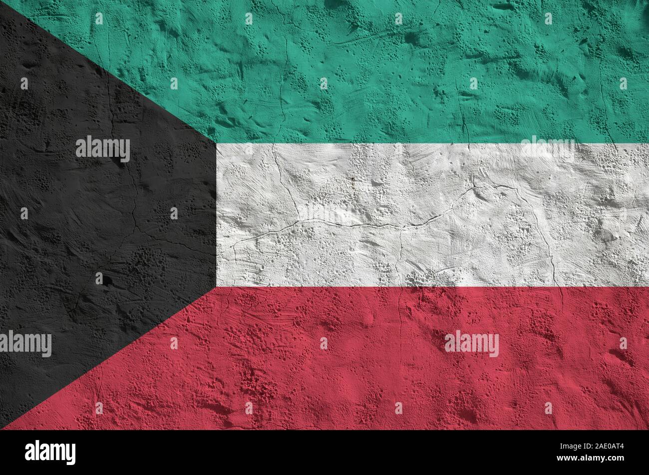 Kuwait flag depicted in bright paint colors on old relief plastering