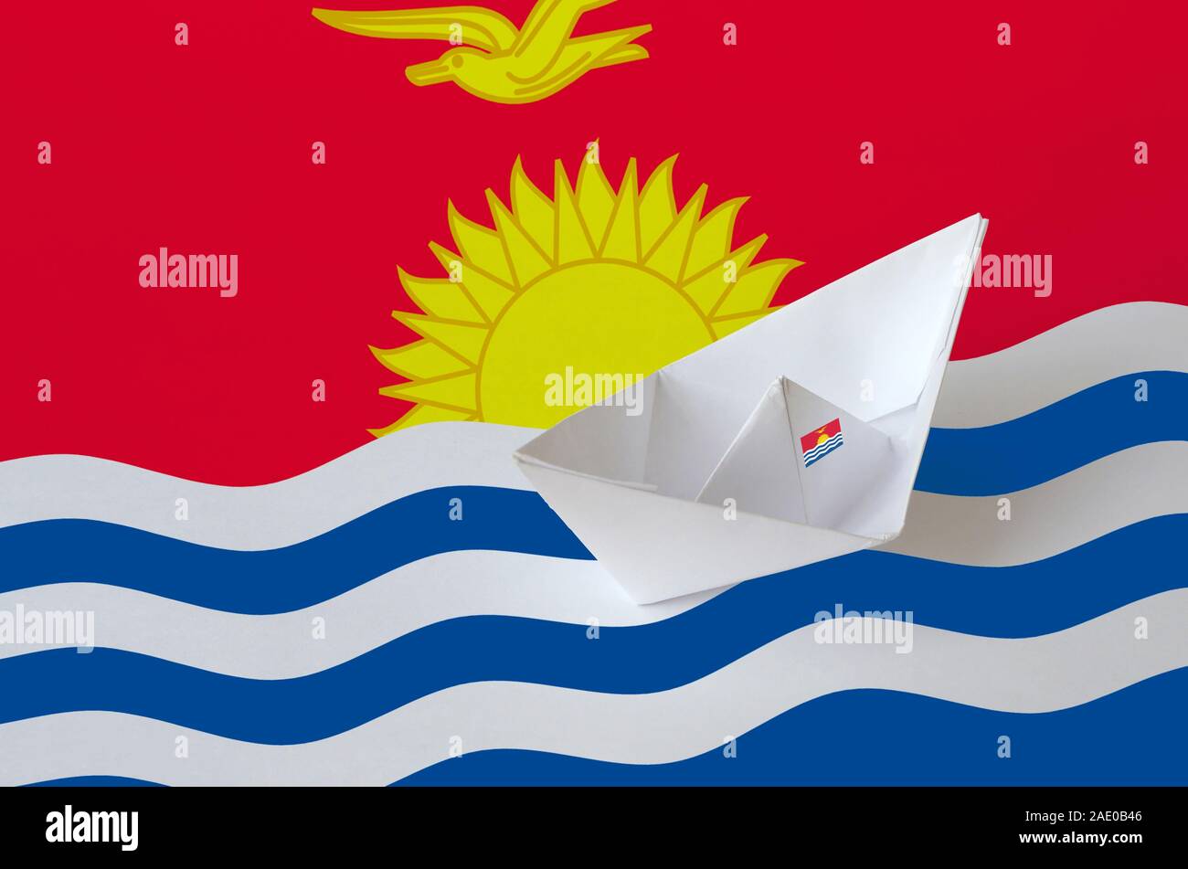 Kiribati flag depicted on paper origami ship closeup. Oriental handmade arts concept Stock Photo