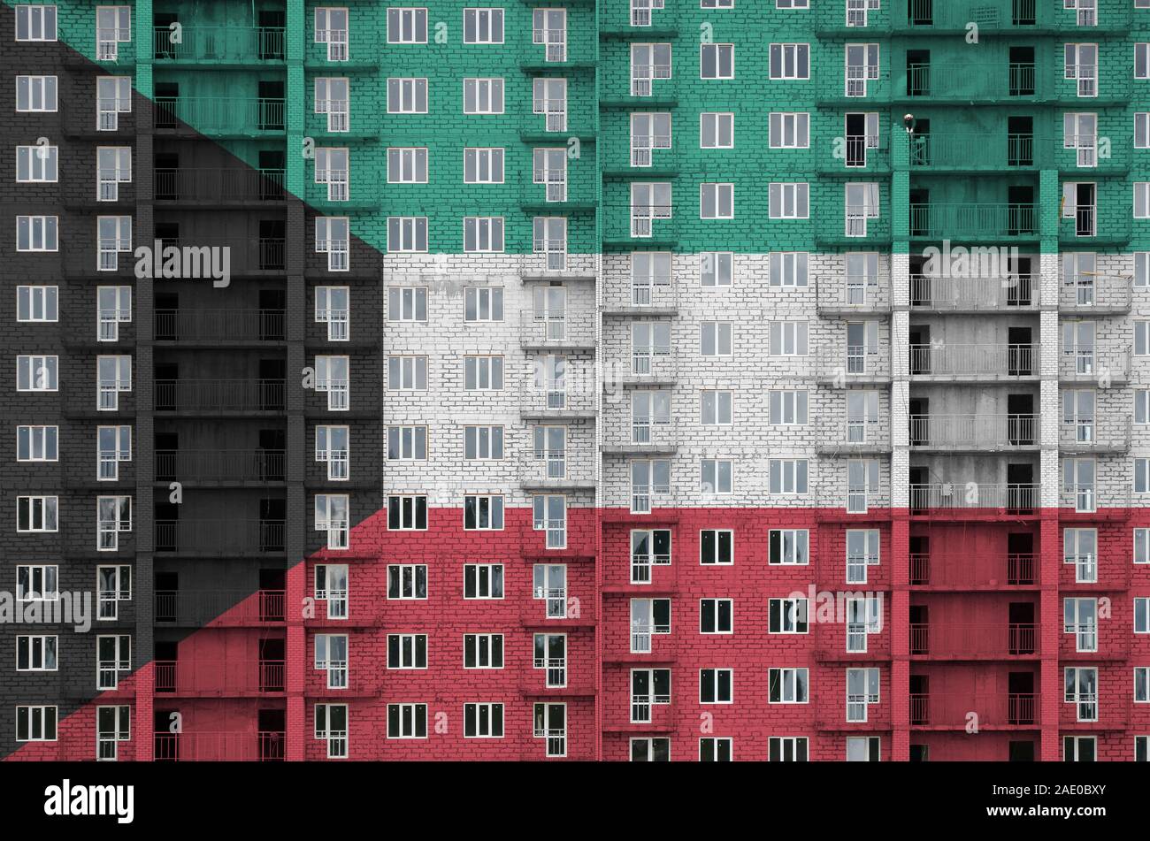 Kuwait flag depicted in paint colors on multistorey residental