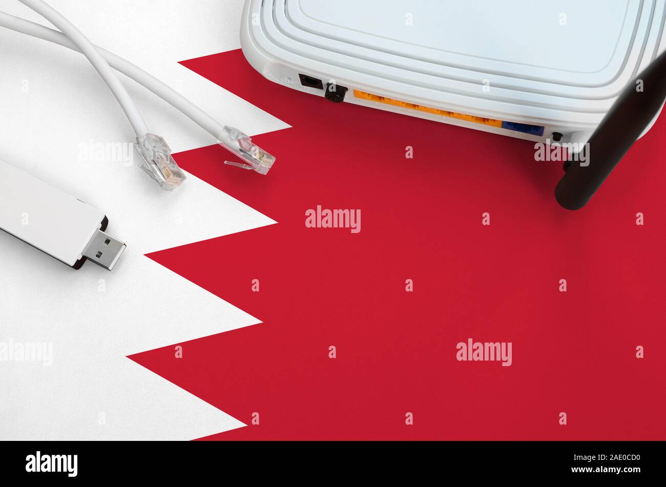Bahrain flag depicted on table with rj45 cable, wireless usb