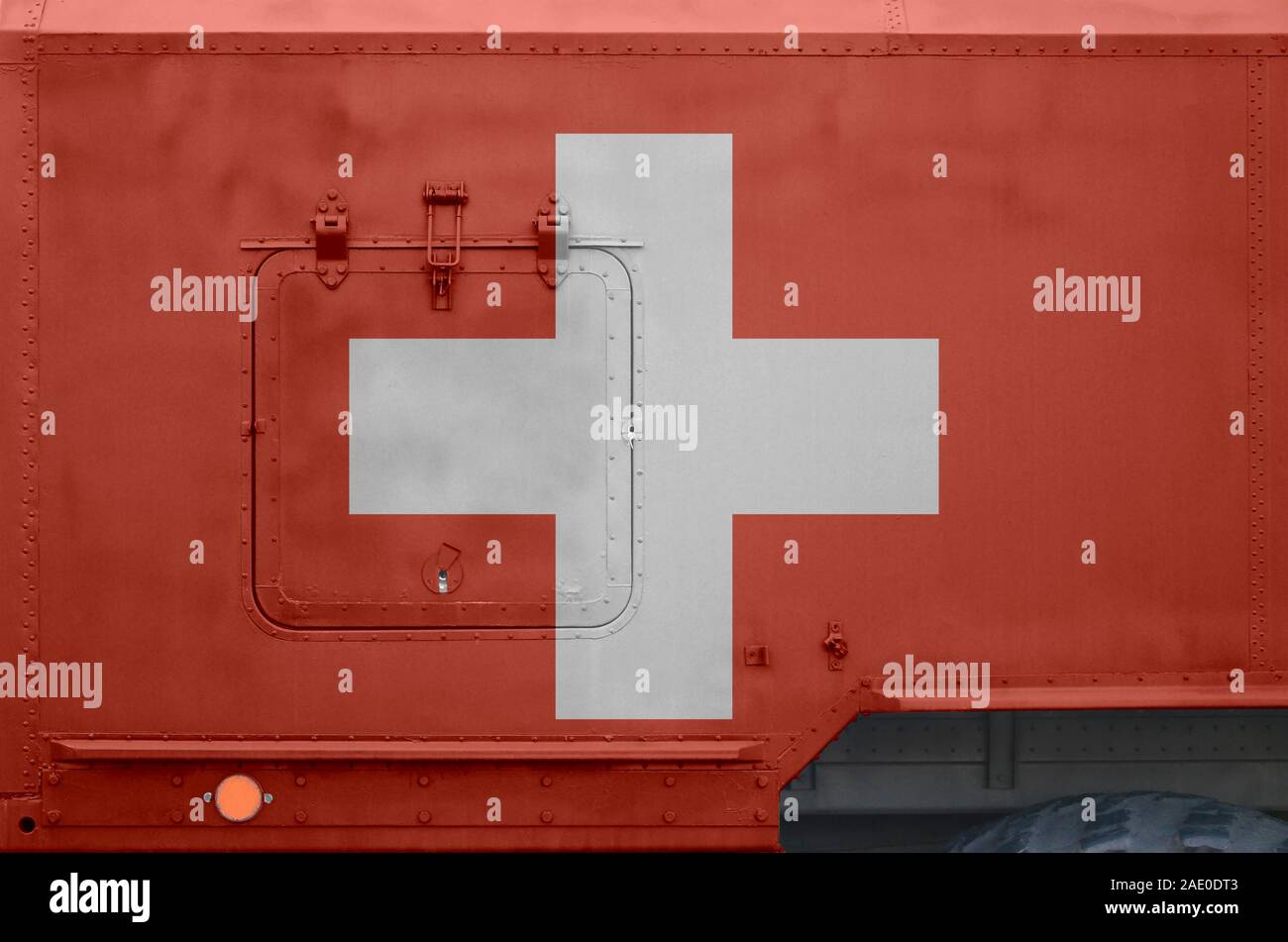 Switzerland flag depicted on side part of military armored truck close