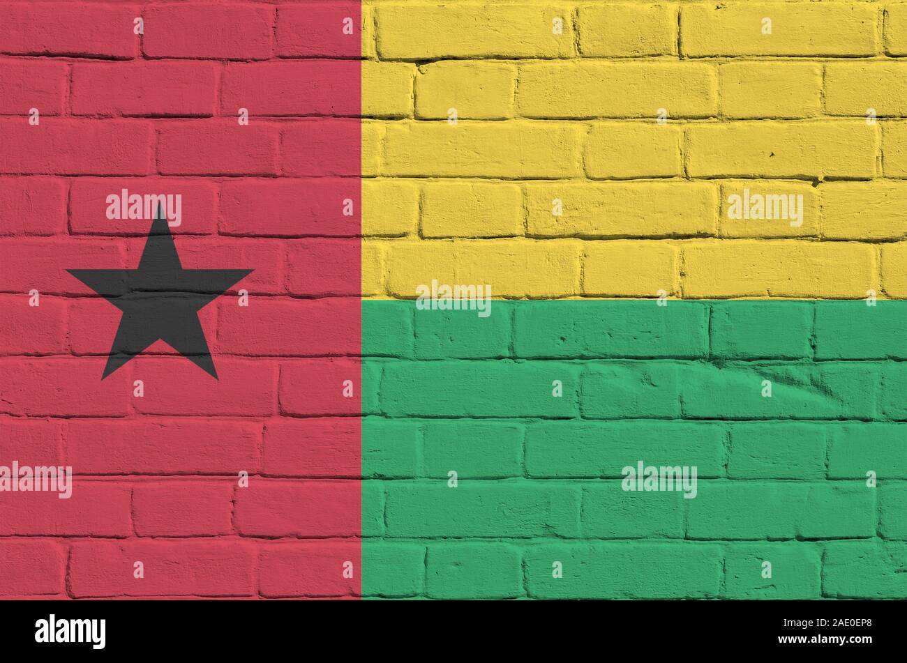 Guinea Bissau flag depicted in paint colors on old brick wall close up ...