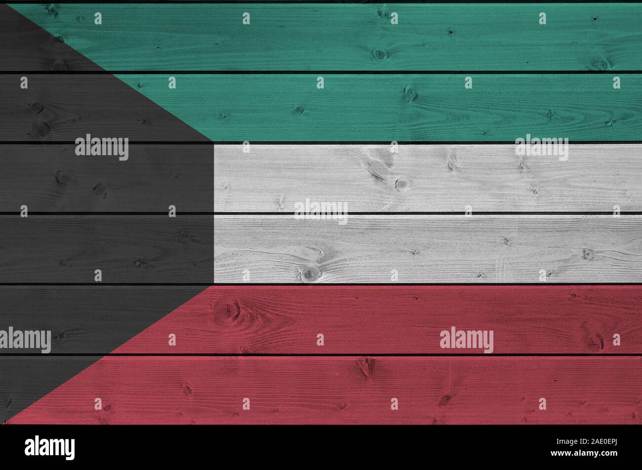 Kuwait flag depicted in bright paint colors on old wooden wall close up