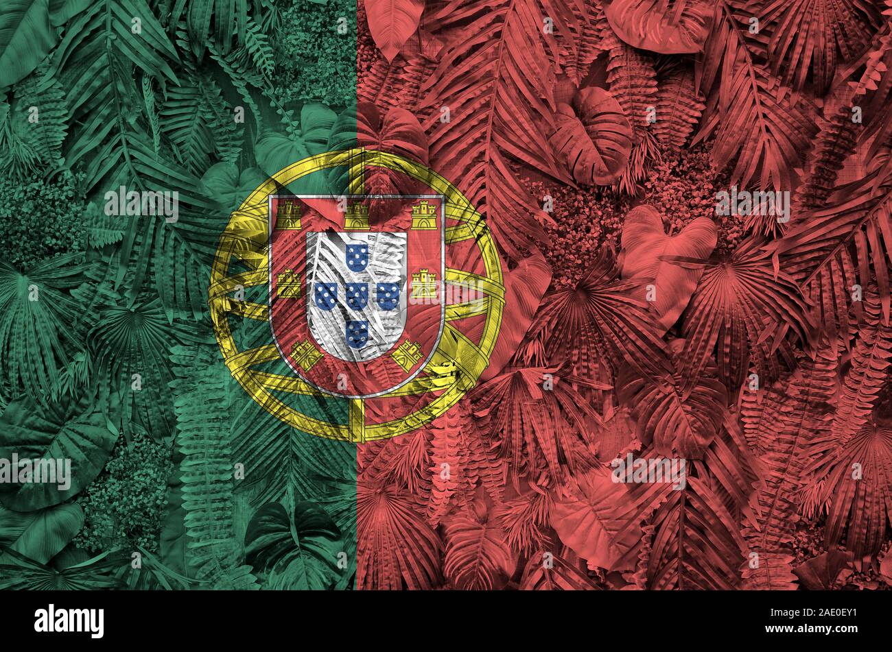 Portugal flag depicted on many leafs of monstera palm trees. Trendy fashionable background Stock Photo