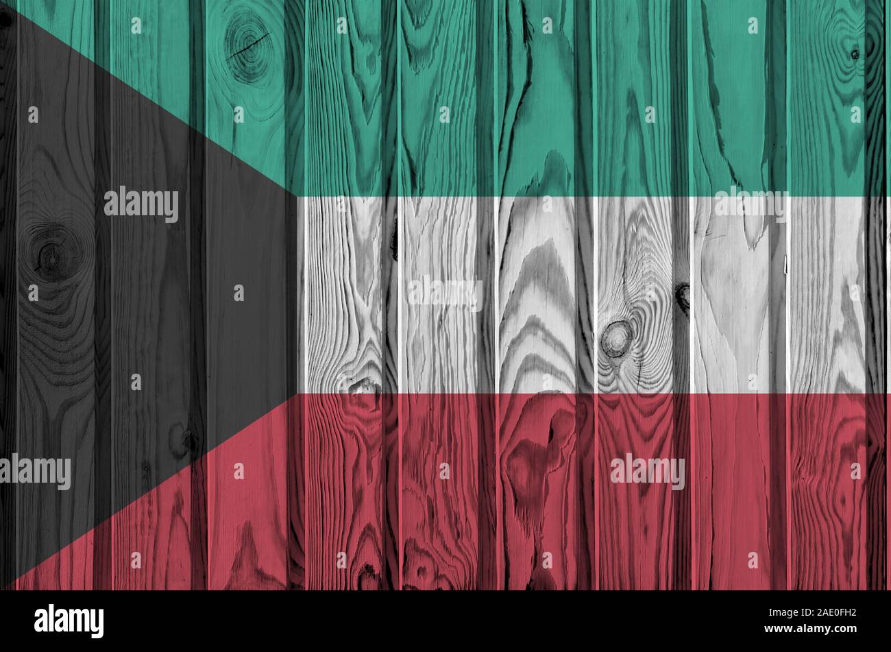 Kuwait flag depicted in bright paint colors on old wooden wall close up