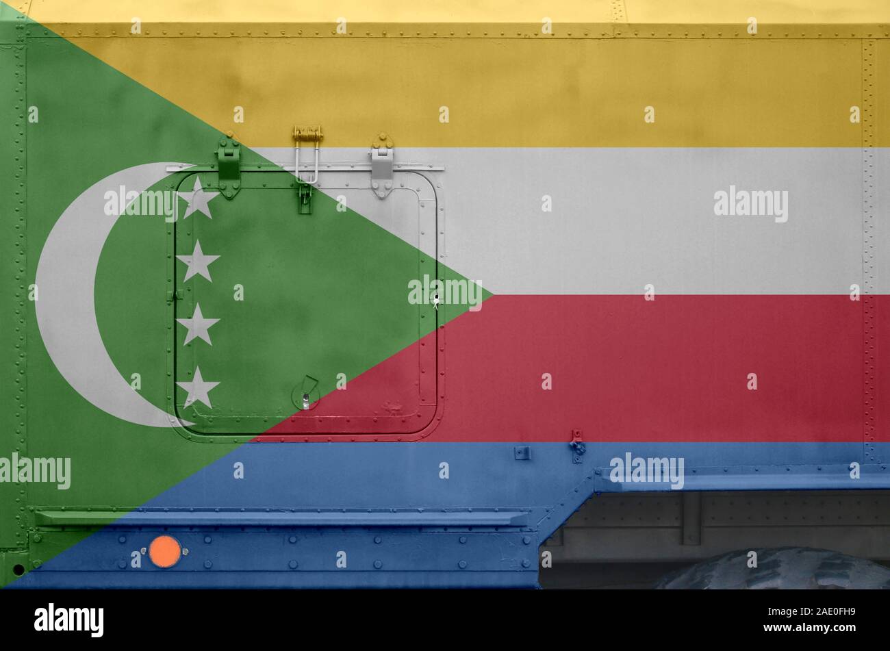 Comoros flag depicted on side part of military armored truck close up