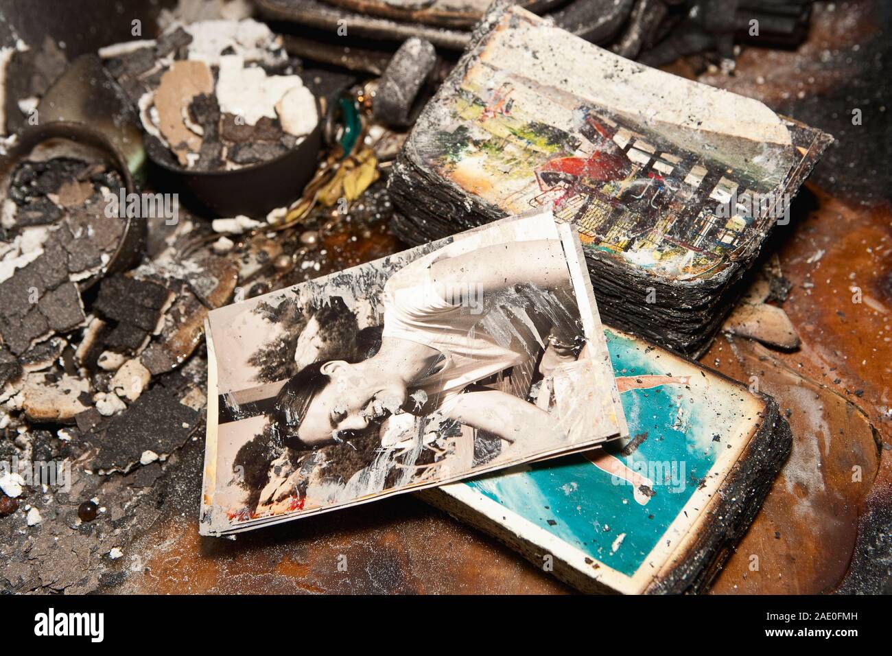 Details of burnt family photos inside a home ravaged by a fire