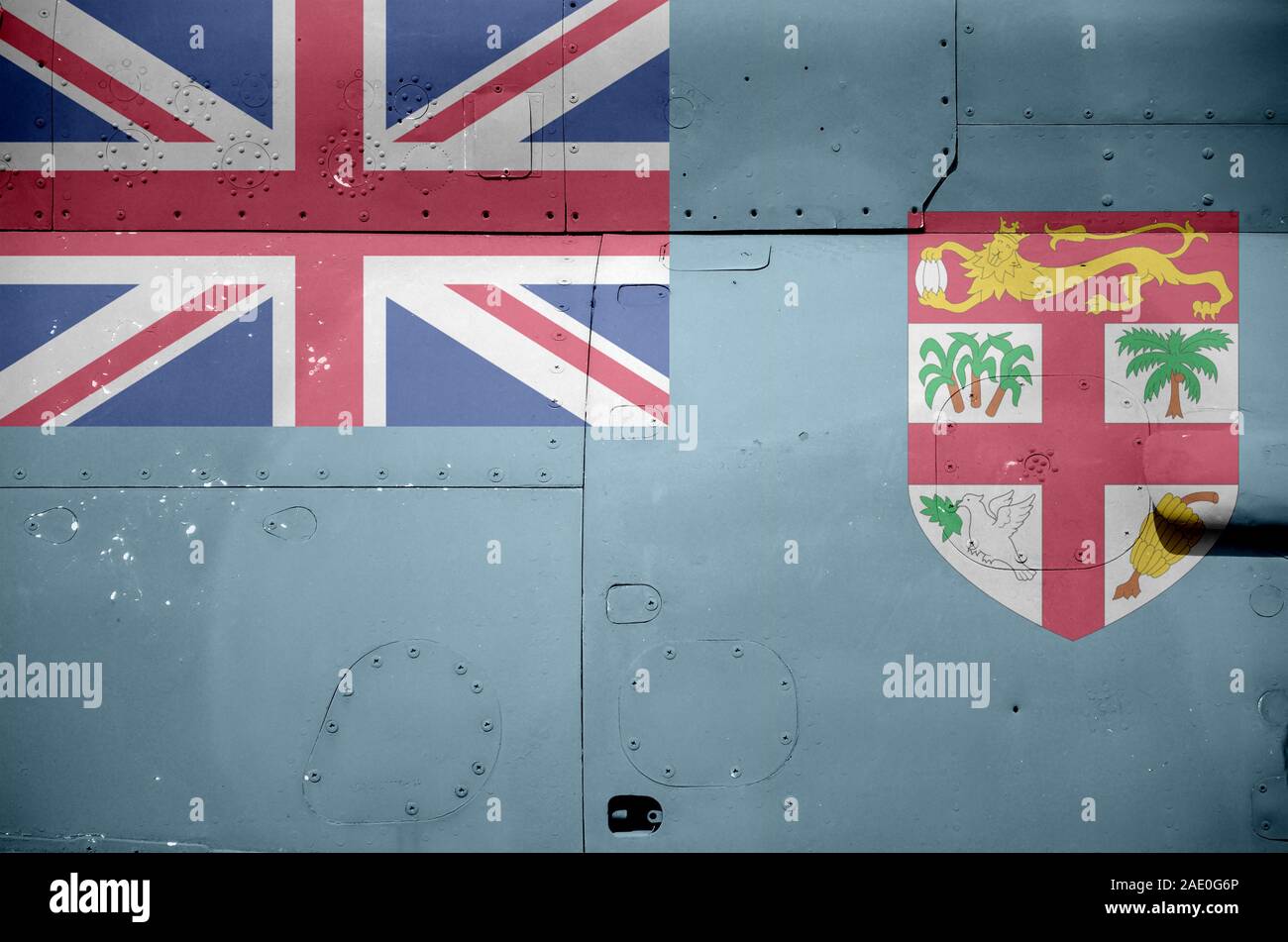 Fiji flag depicted on side part of military armored helicopter close up. Army forces aircraft conceptual background Stock Photo