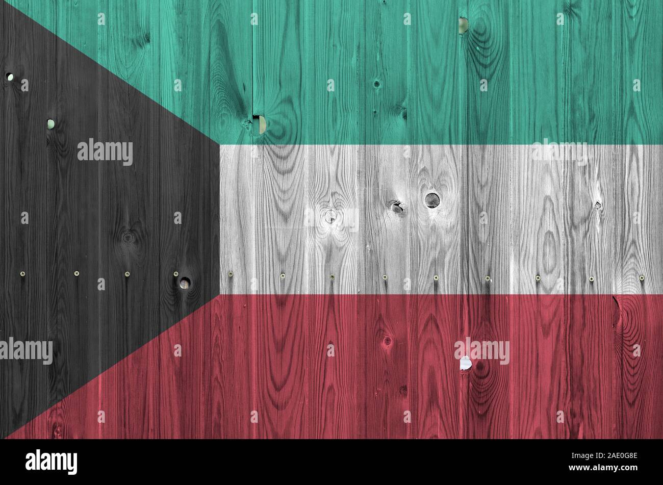 Kuwait flag depicted in bright paint colors on old wooden wall close up