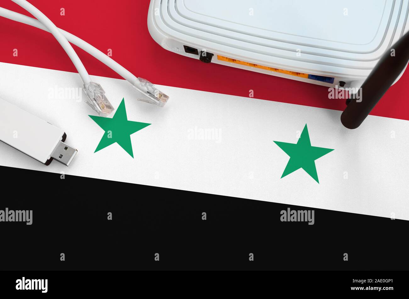 Syria flag depicted on table with internet rj45 cable, wireless usb wi ...