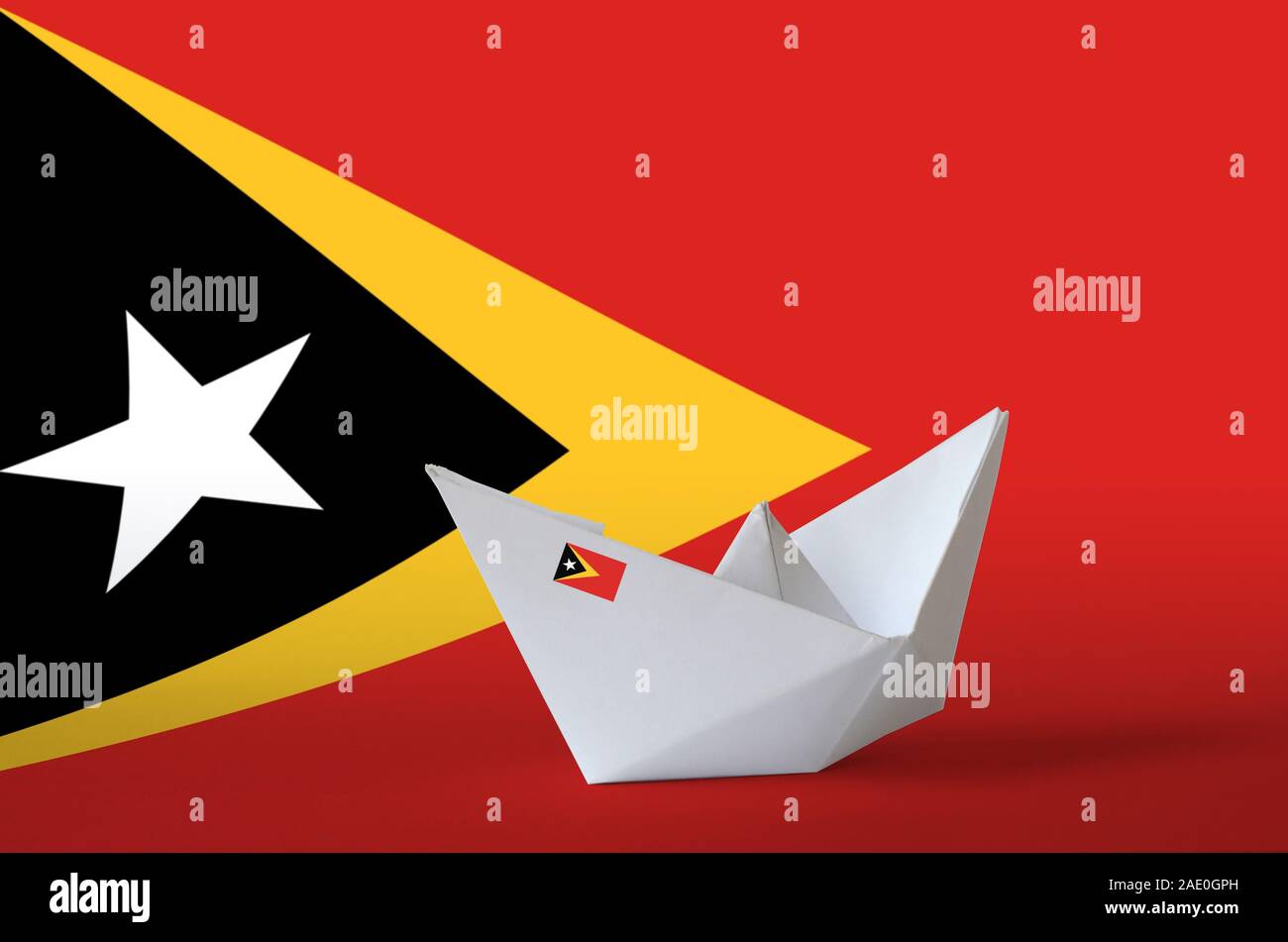 Timor Leste flag depicted on paper origami ship closeup. Oriental handmade arts concept Stock Photo