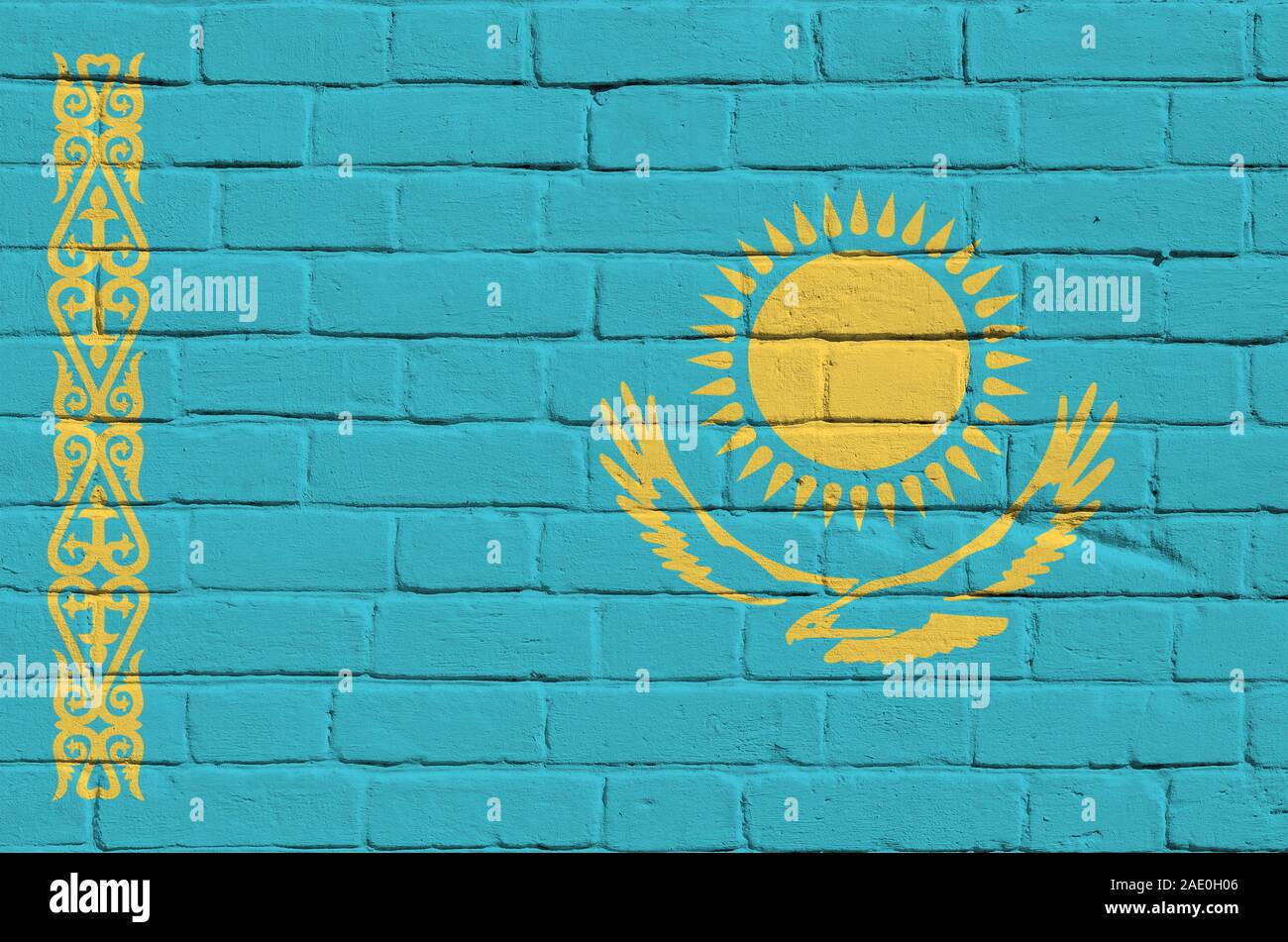 Kazakhstan flag depicted in paint colors on old brick wall close up ...