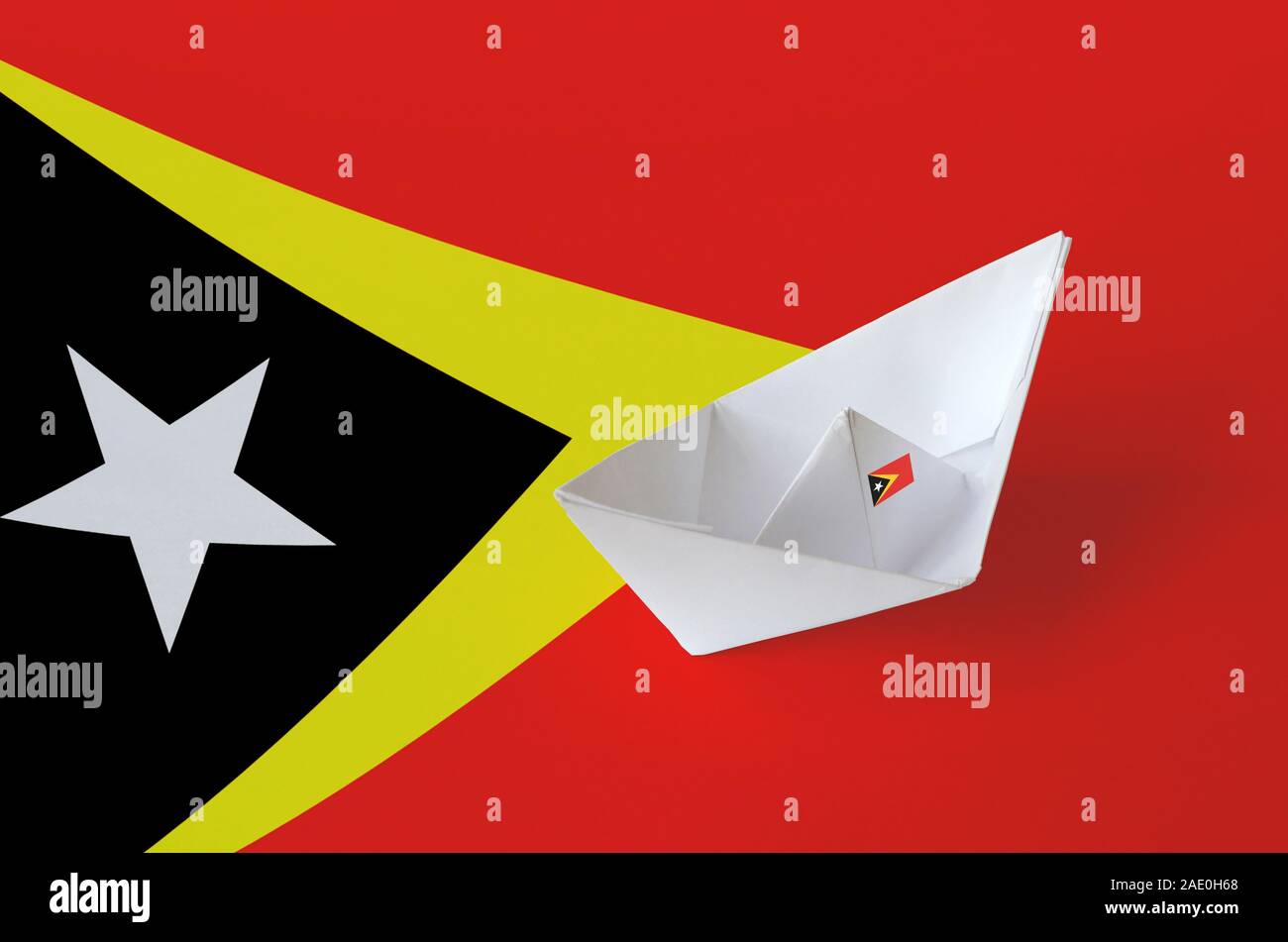 Timor Leste flag depicted on paper origami ship closeup. Oriental handmade arts concept Stock Photo