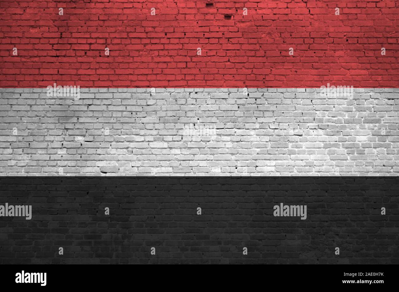 Yemen flag depicted in paint colors on old brick wall close up ...