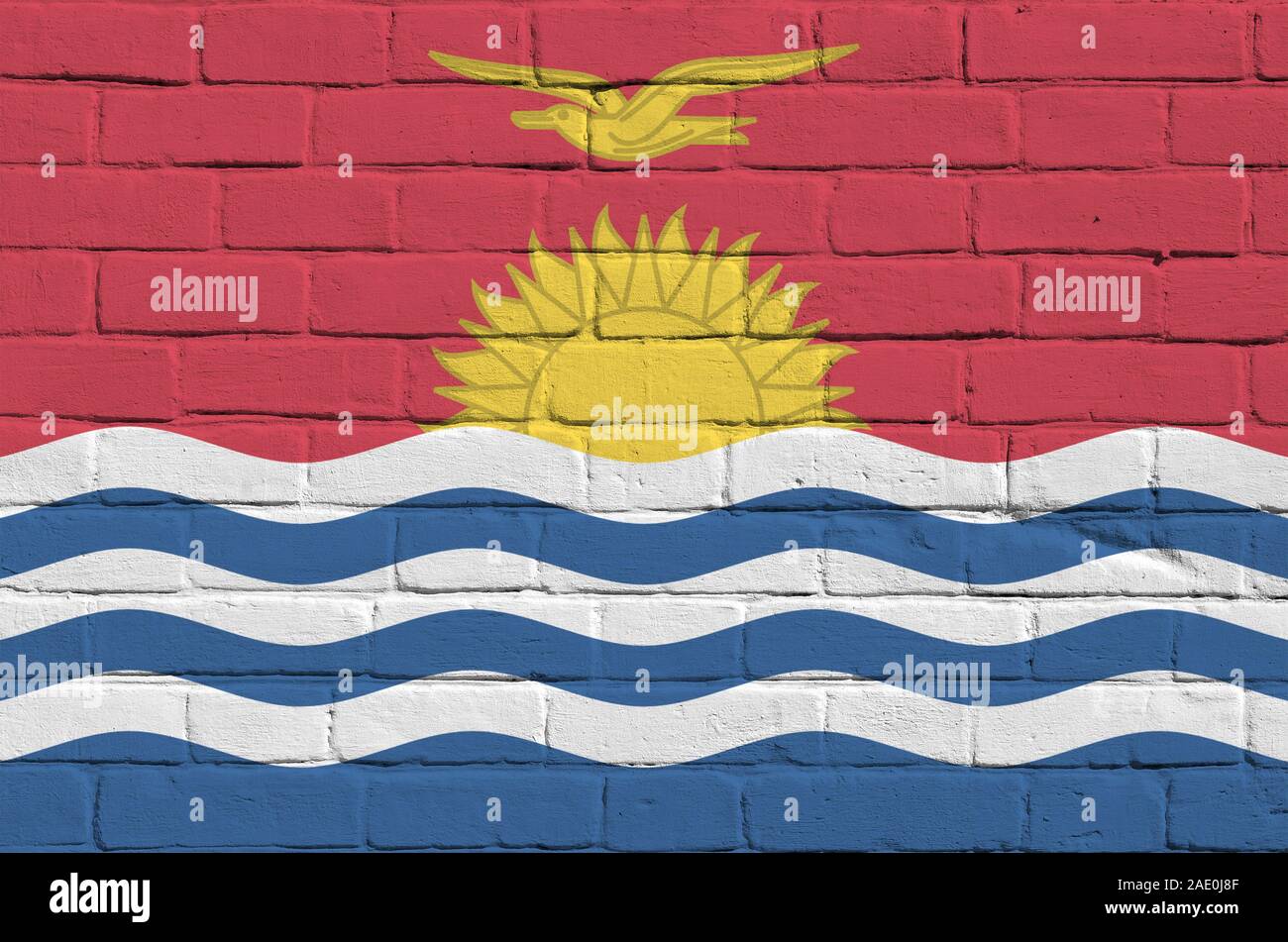 Kiribati flag depicted in paint colors on old brick wall close up. Textured banner on big brick wall masonry background Stock Photo