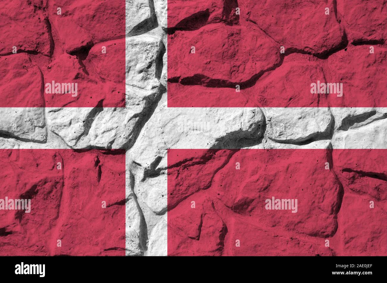 Denmark flag depicted in paint colors on old stone wall close up ...