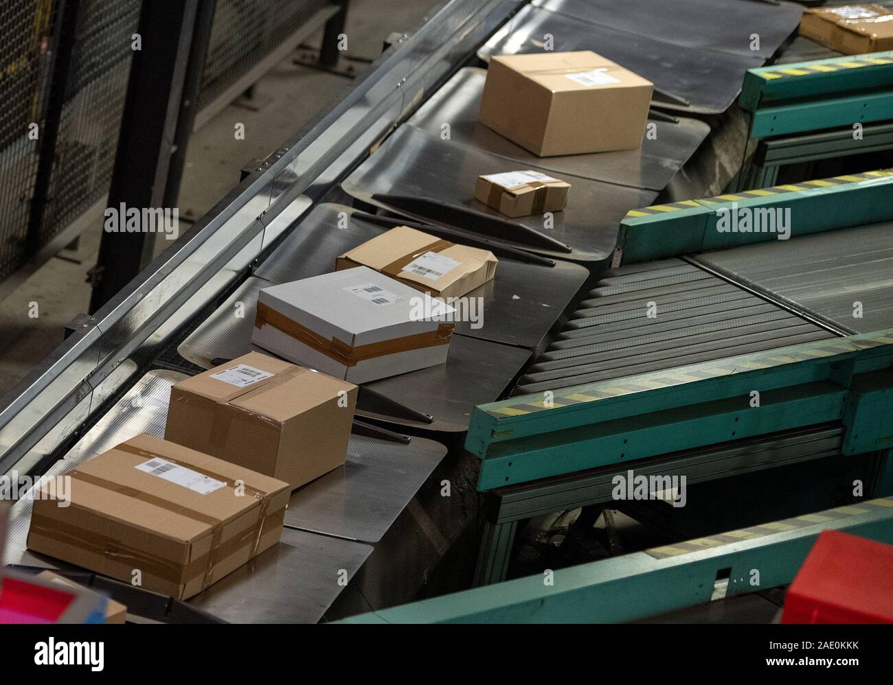 05 December 2019, Brandenburg, Börnicke: Numerous parcels travel on conveyor belts through the DHL-Paketzentrum. During Advent, up to 570,000 shipments a day arrive at their destination from Börnicke, with 200 additional employees deployed. Photo: Monika Skolimowska/dpa-Zentralbild/ZB Stock Photo