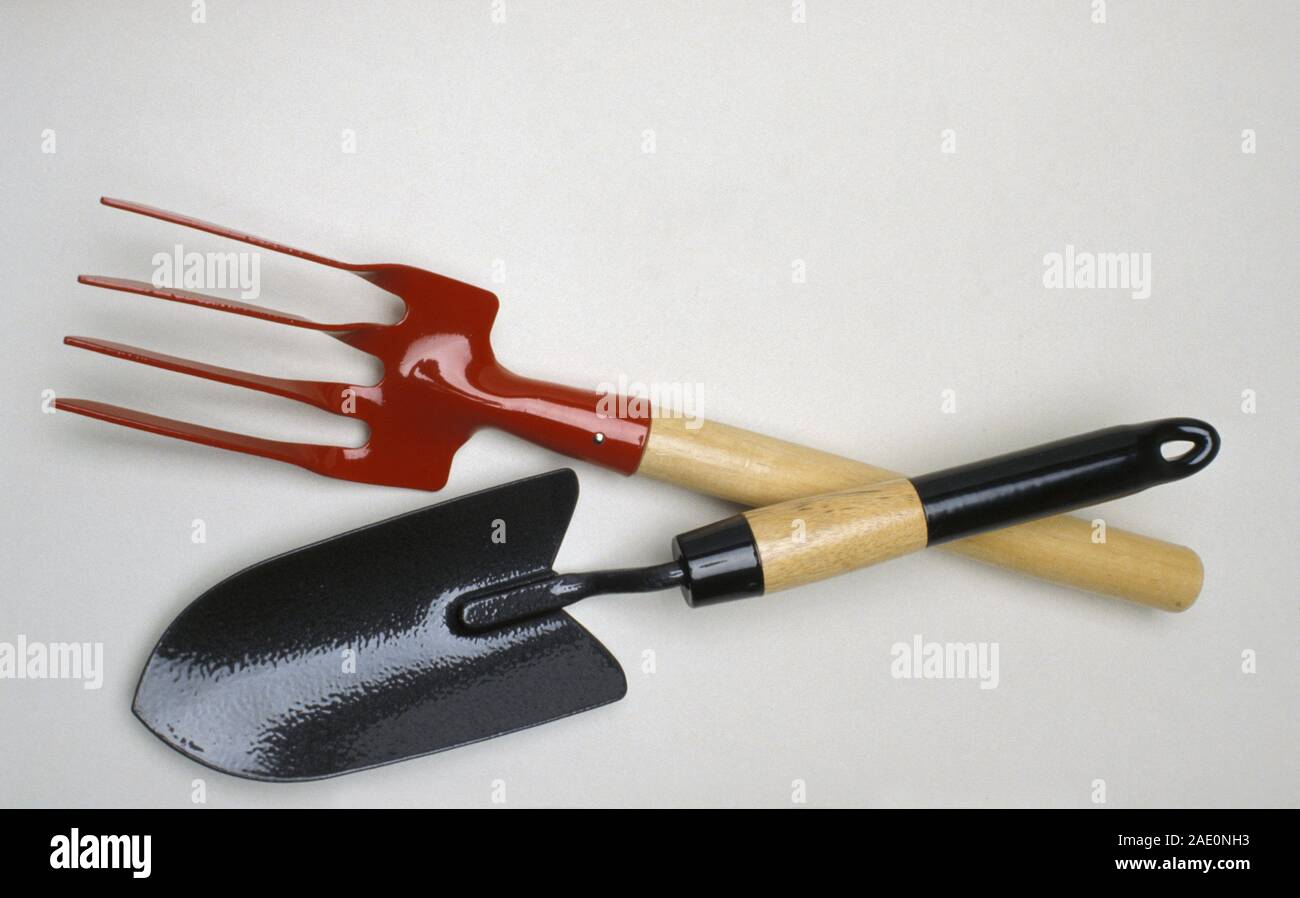 Hand gardening tools, small fork and hand shovel. Stock Photo