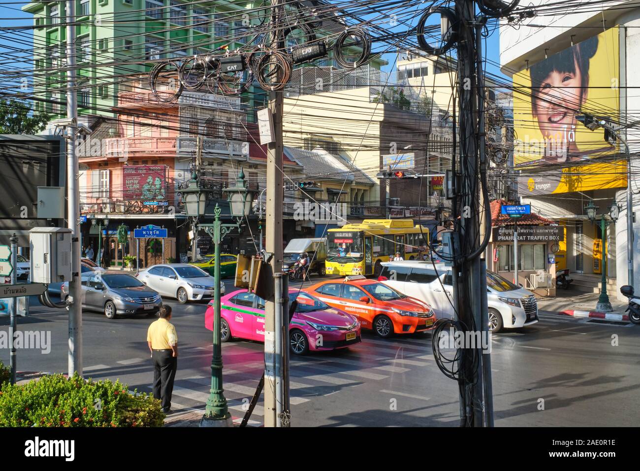 A messy street scene / city view in Ban Mo / Phahurat (Pahurat) area, Bangkok, Thailand, with chaotic power cables & disparate styles of architecture Stock Photo
