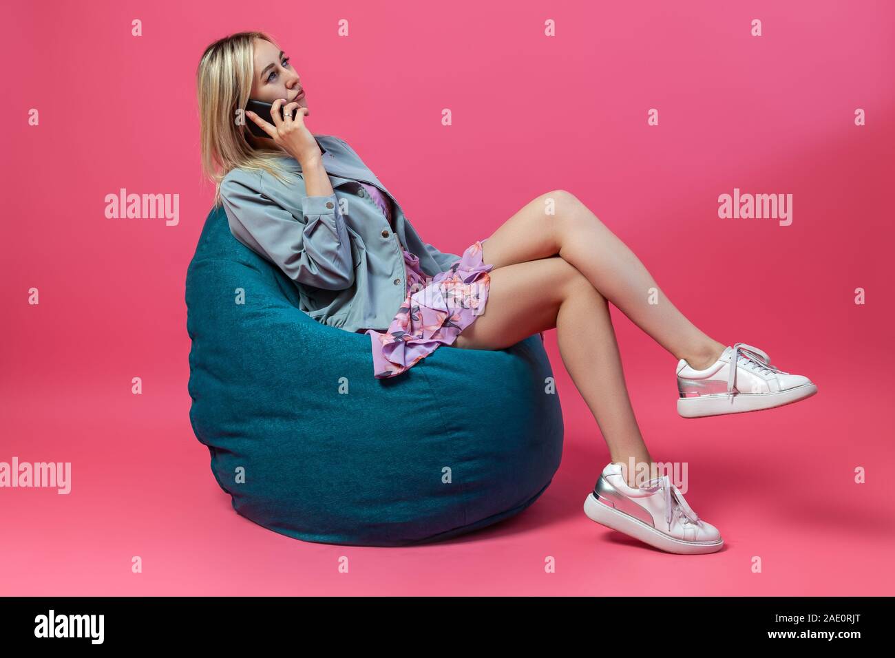 Girl sitting on beanbag chair hi-res stock photography and images - Alamy