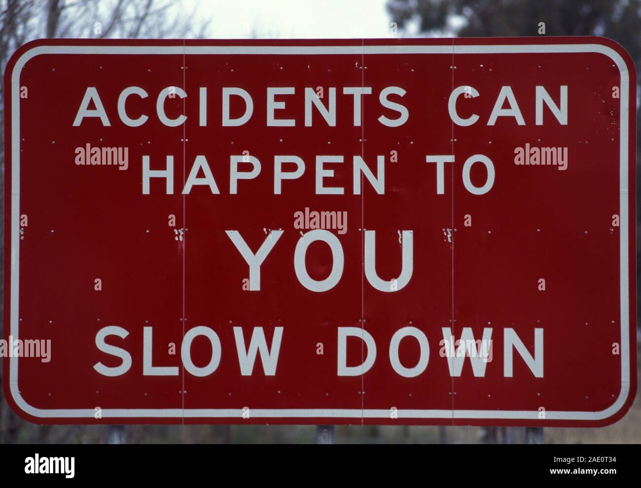 AUSTRALIAN ROAD SIGN 'ACCIDENTS CAN HAPPEN TO YOU SLOW DOWN' Stock Photo