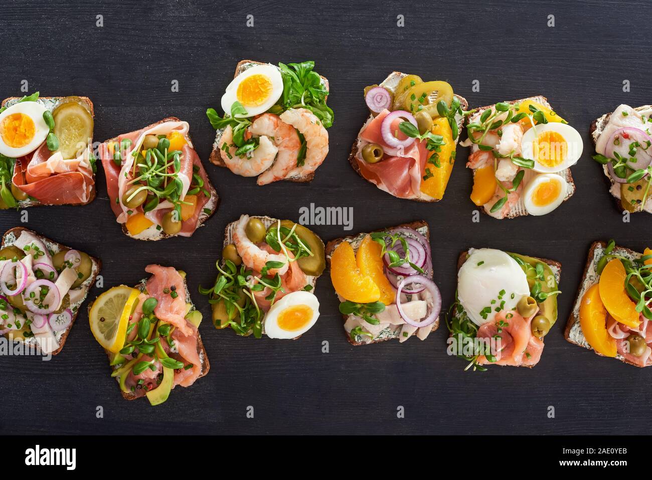 top view of rye bread with smorrebrod sandwiches on grey surface Stock ...