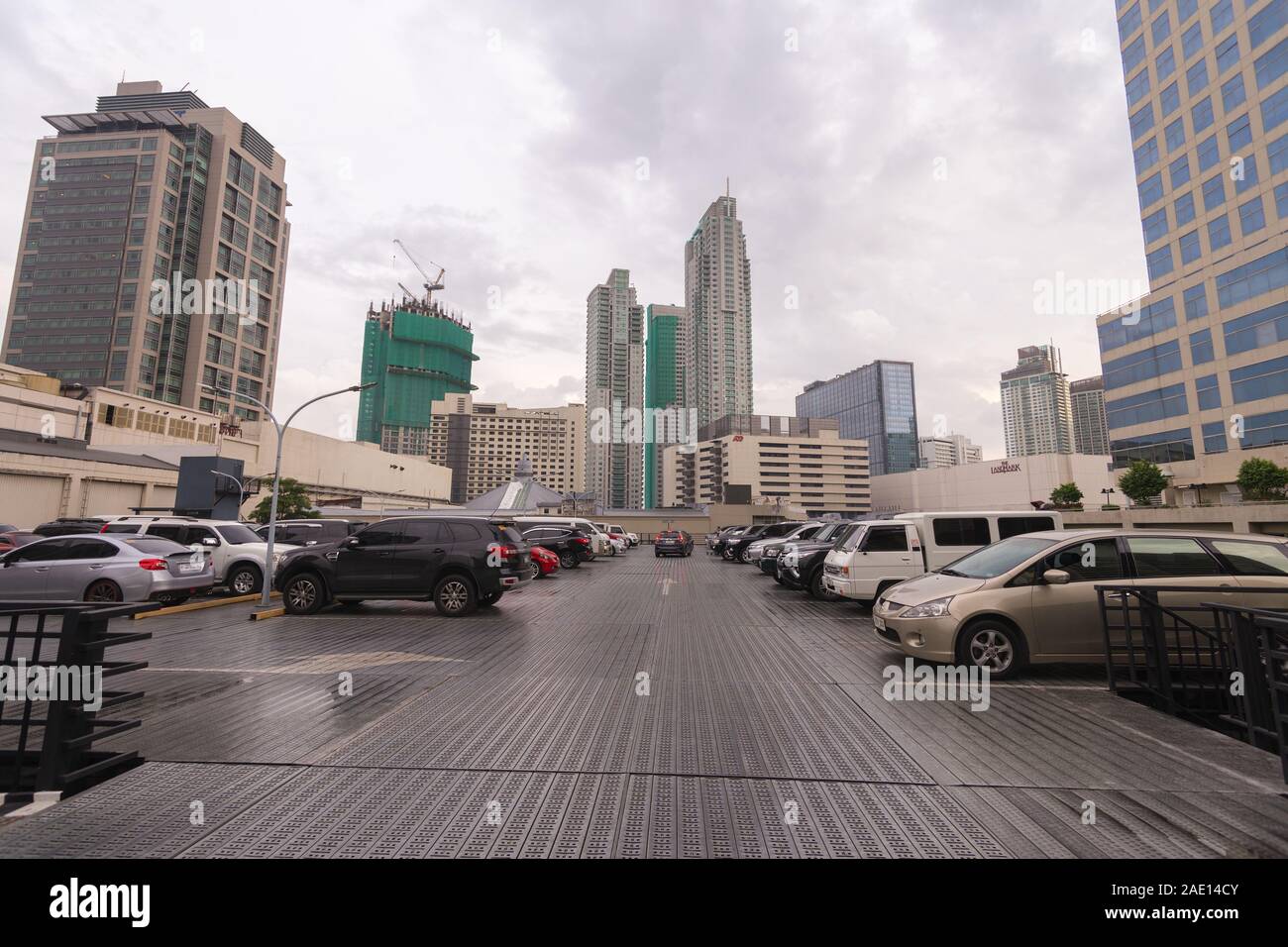 Manila, Philippines - August 22, 2017: Traffic and cars at intersection in Makati in rush hour Stock Photo