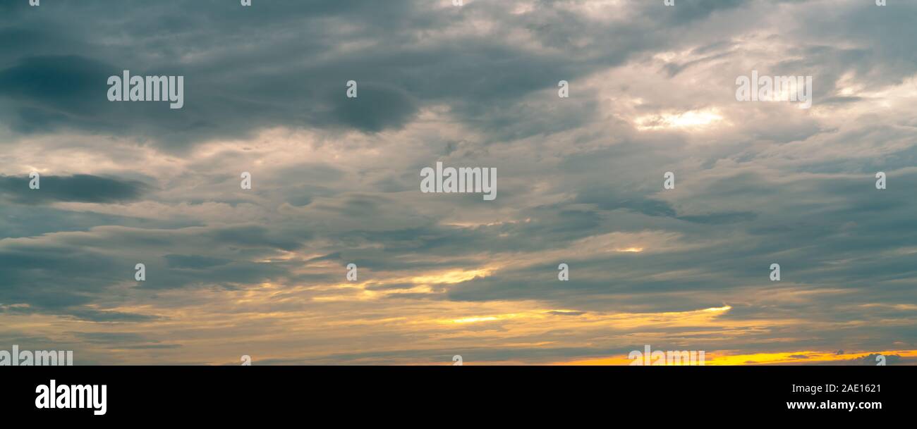 Morning sunrise sky and white clouds. Beautiful golden sunrise sky with white fluffy clouds. White fluffy cloudscape abstract background. Beauty Stock Photo