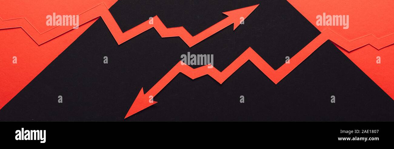 panoramic shot of paper cur recession and increase arrows on black and red background Stock Photo