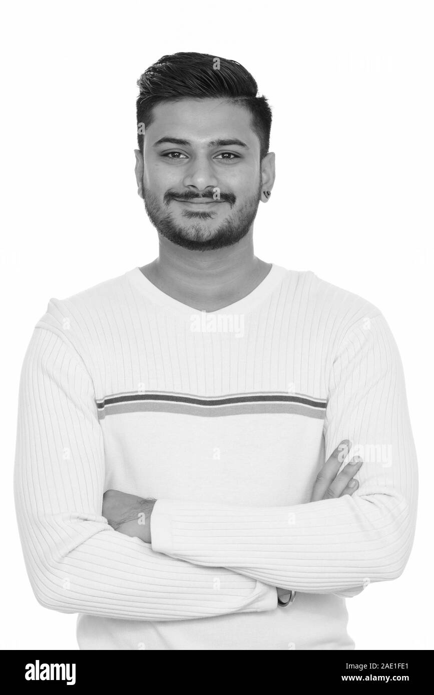 Young happy handsome Indian man with arms crossed Stock Photo Alamy