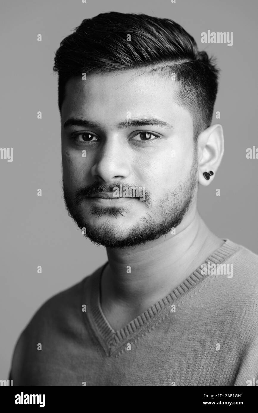 Face of young handsome Indian man in black and white Stock Photo - Alamy