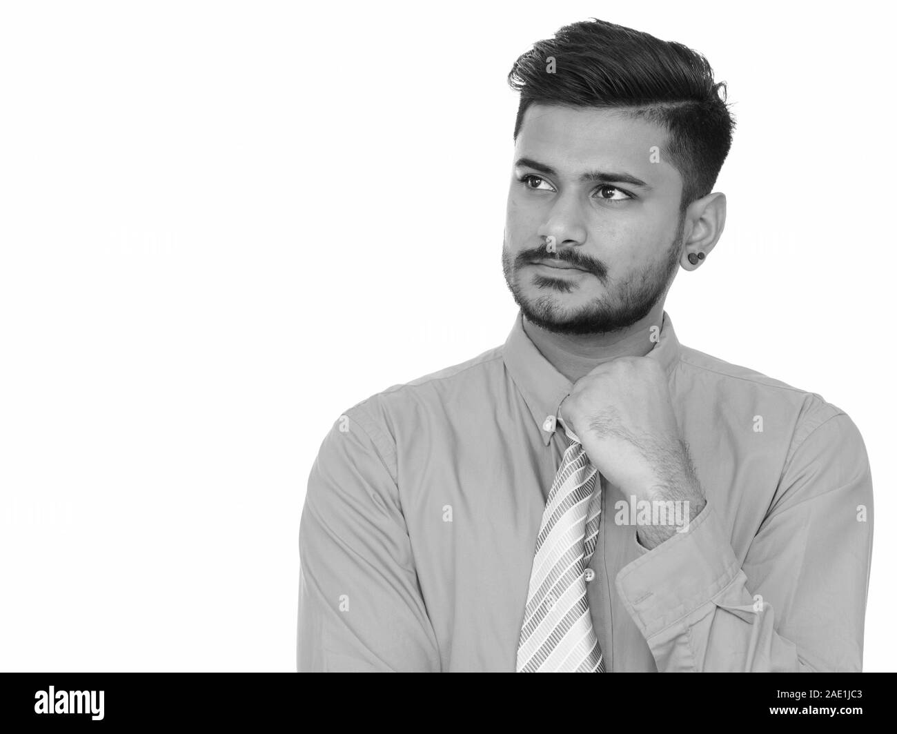 Young Handsome Indian Businessman Thinking In Black And White Stock
