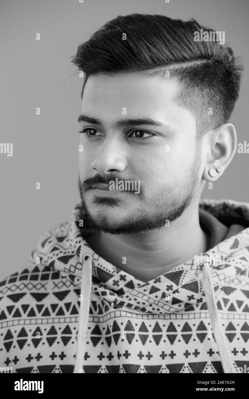 Handsome indian man in black Black and White Stock Photos & Images - Alamy