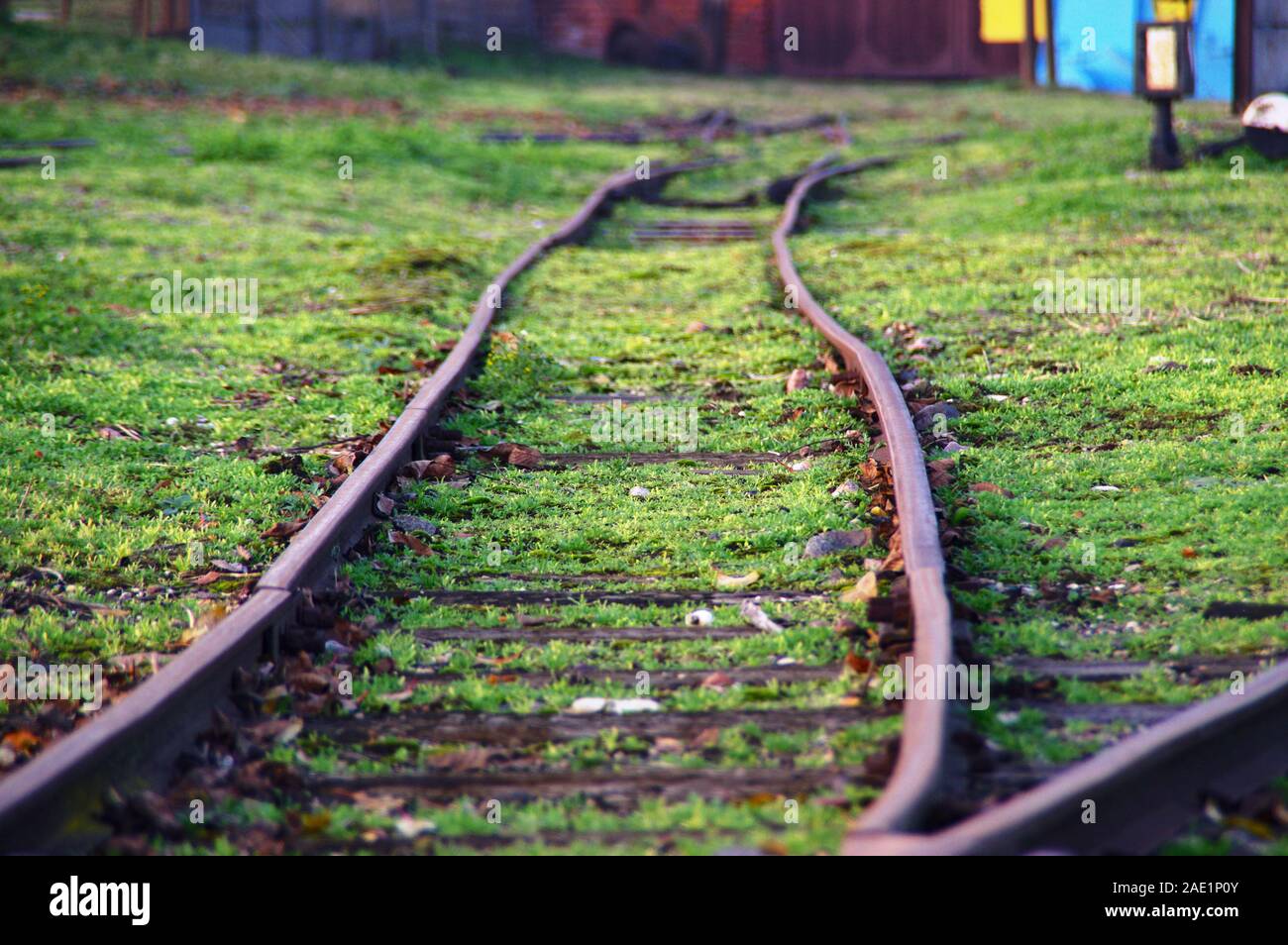 Old rusty and folded railway. Damaged train road in macro view. Stock Photo