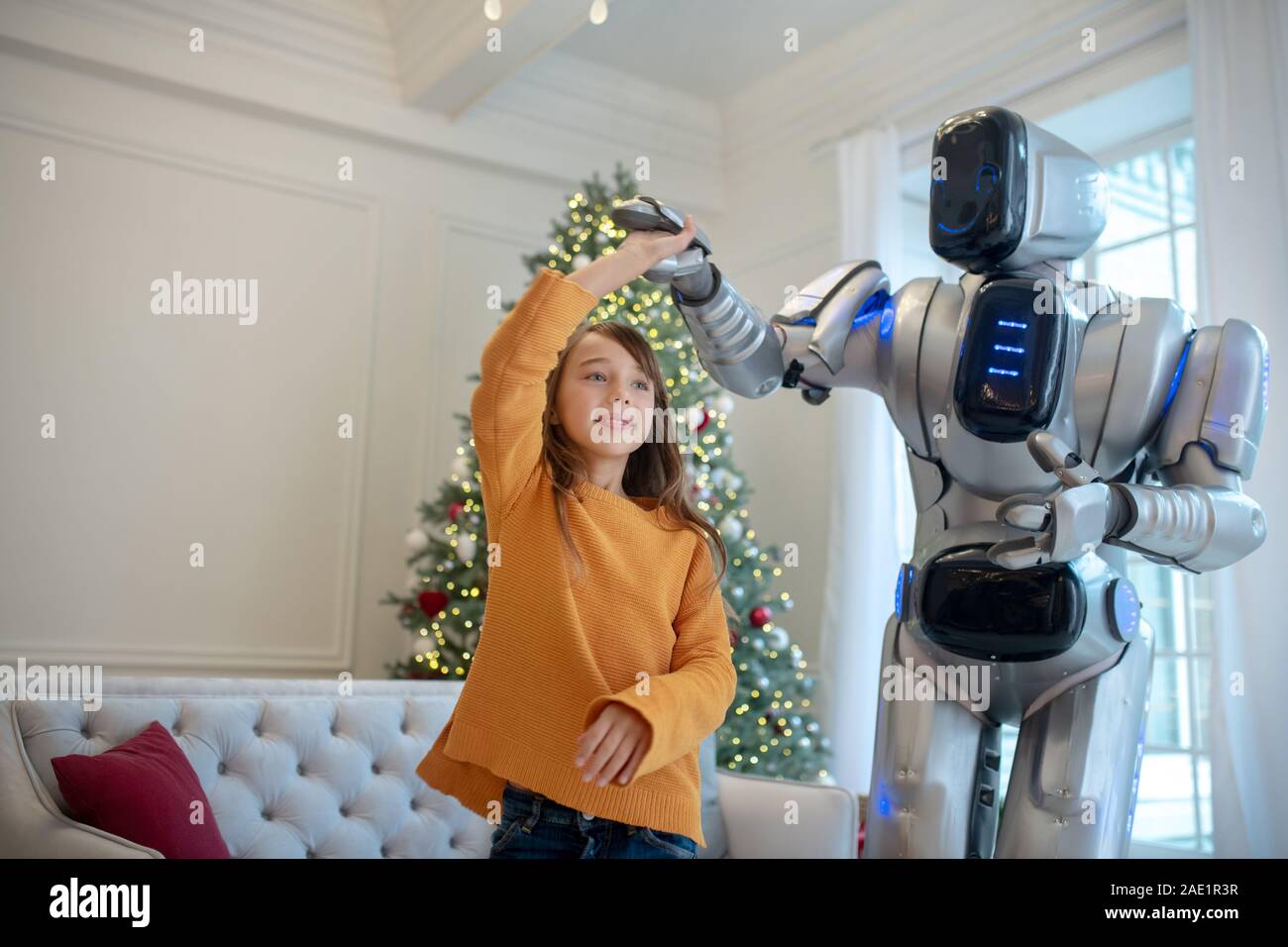 Young woman is dancing with a robot who , Stock Video