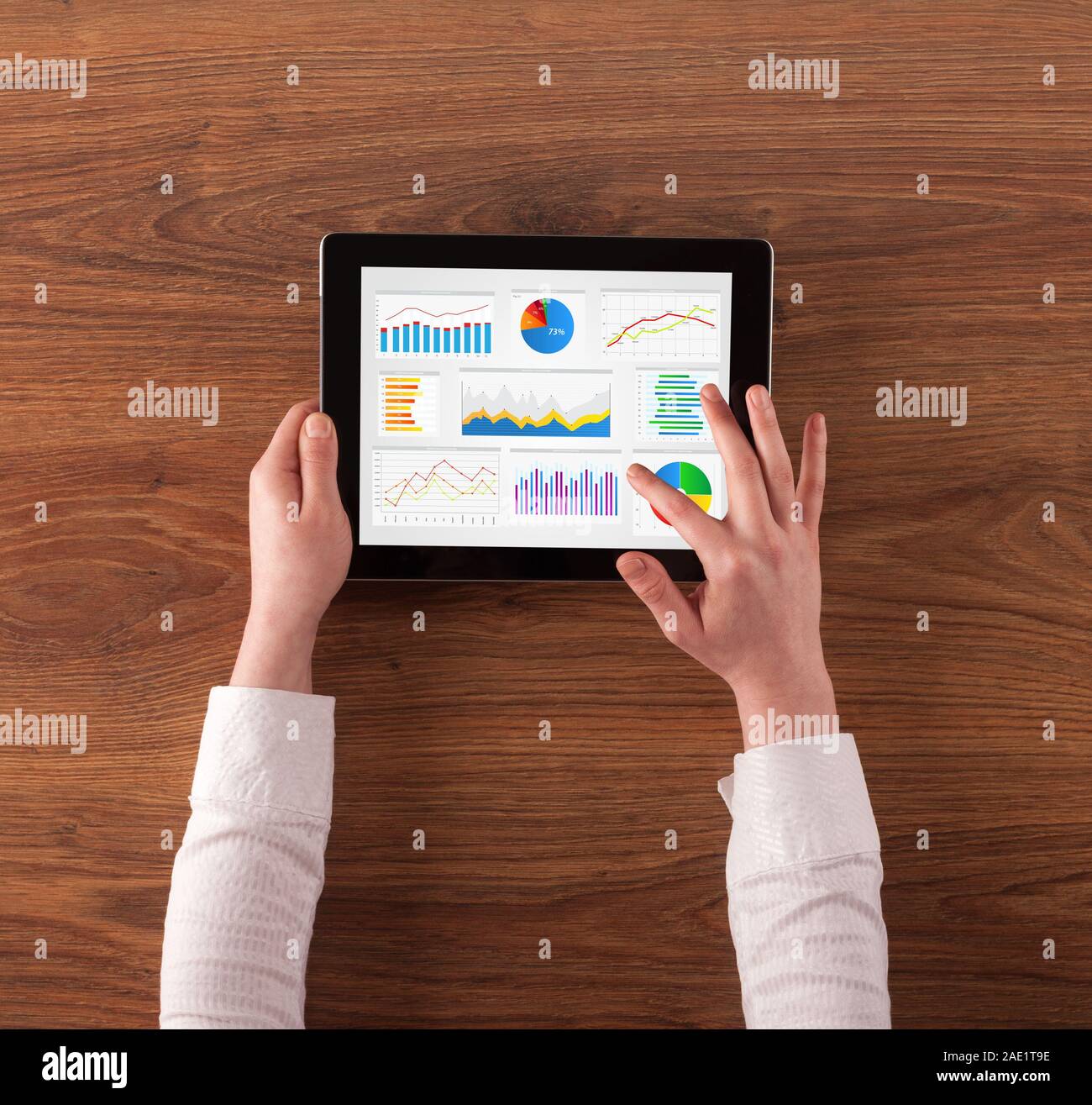 Hand making diagrams and charts on tablet Stock Photo - Alamy
