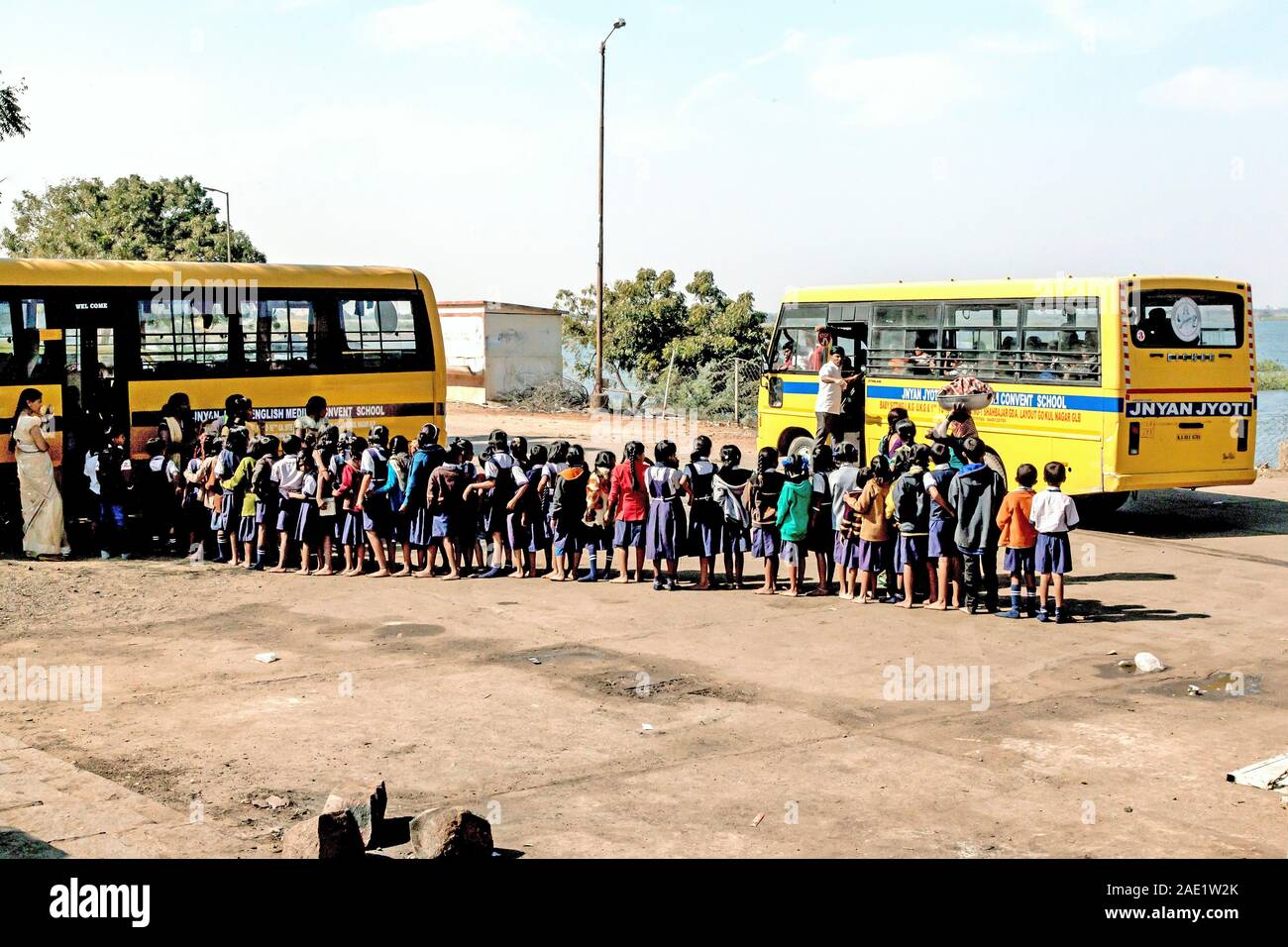 Students queue, School bus, Hampi, Karnataka, India, Asia Stock Photo