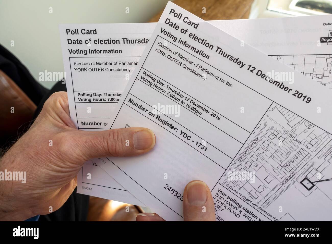 Man person holding Poll Polling Cards for the 2019 General Election England UK United Kingdom GB Great Britain Stock Photo