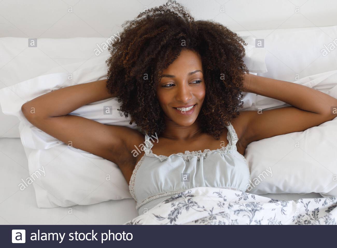 Young Beautiful Cheerful Woman Relaxing In The Bed In The Morning