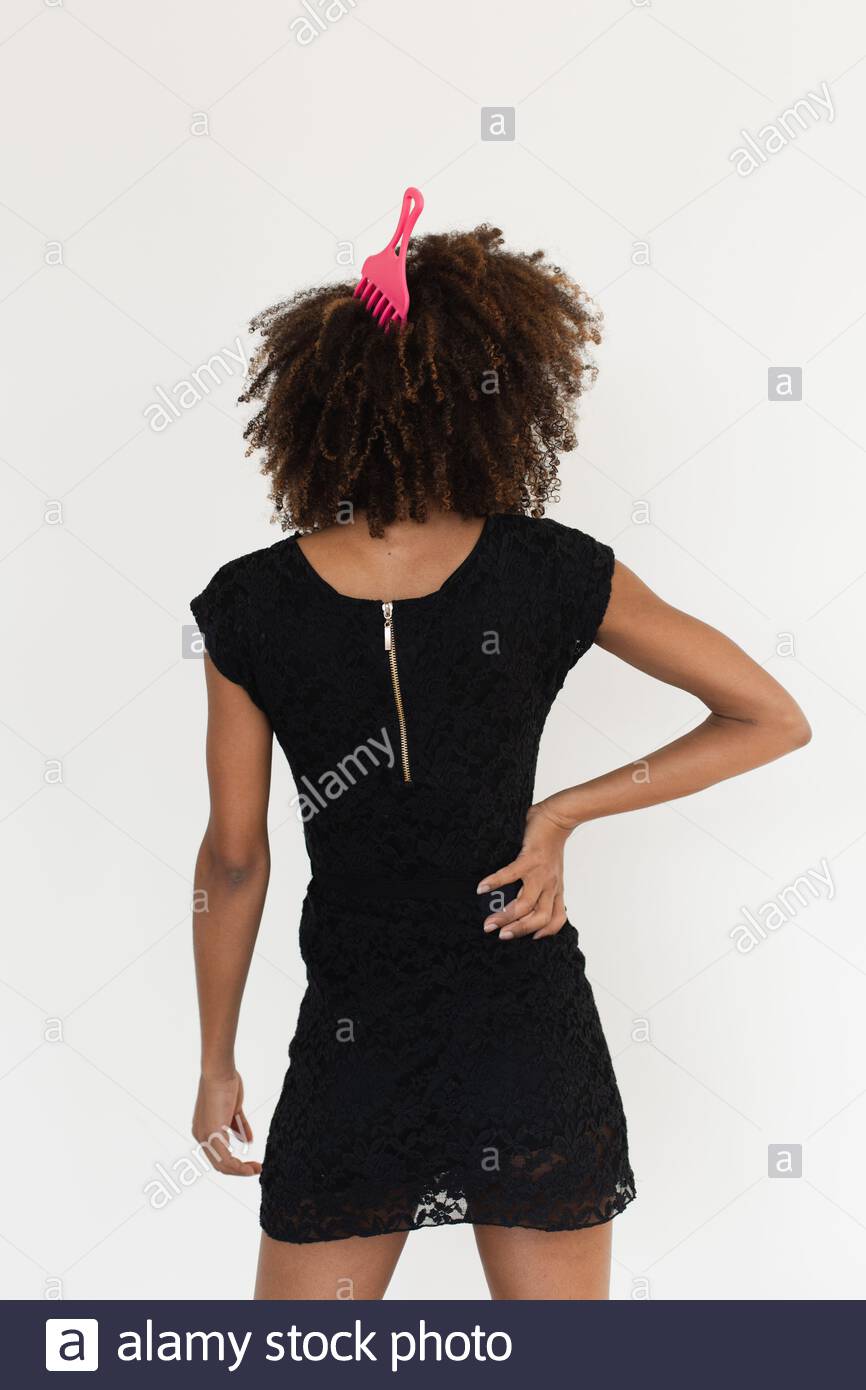 Back View Afro Hairstyle Woman Using Comb For Untangle Her Curly