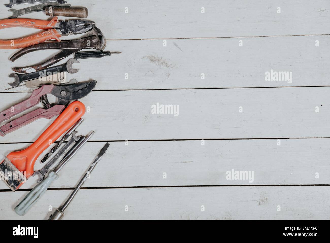 tools for repairs lies on the white boards Stock Photo