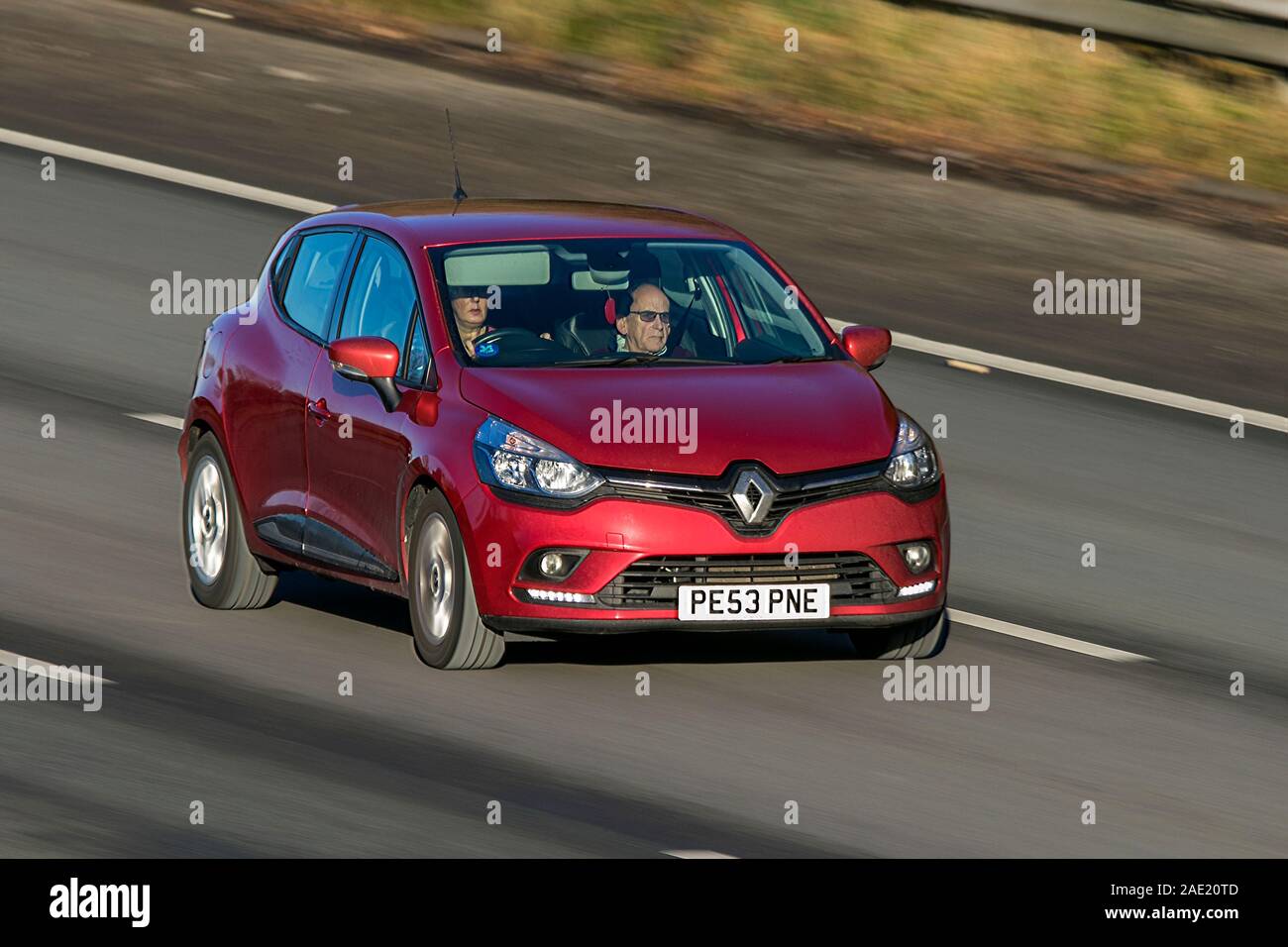 Blurred moving car Renault Clio Dynamique Nav traveling at speed on the M61 motorway Slow camera shutter speed vehicle movement Stock Photo